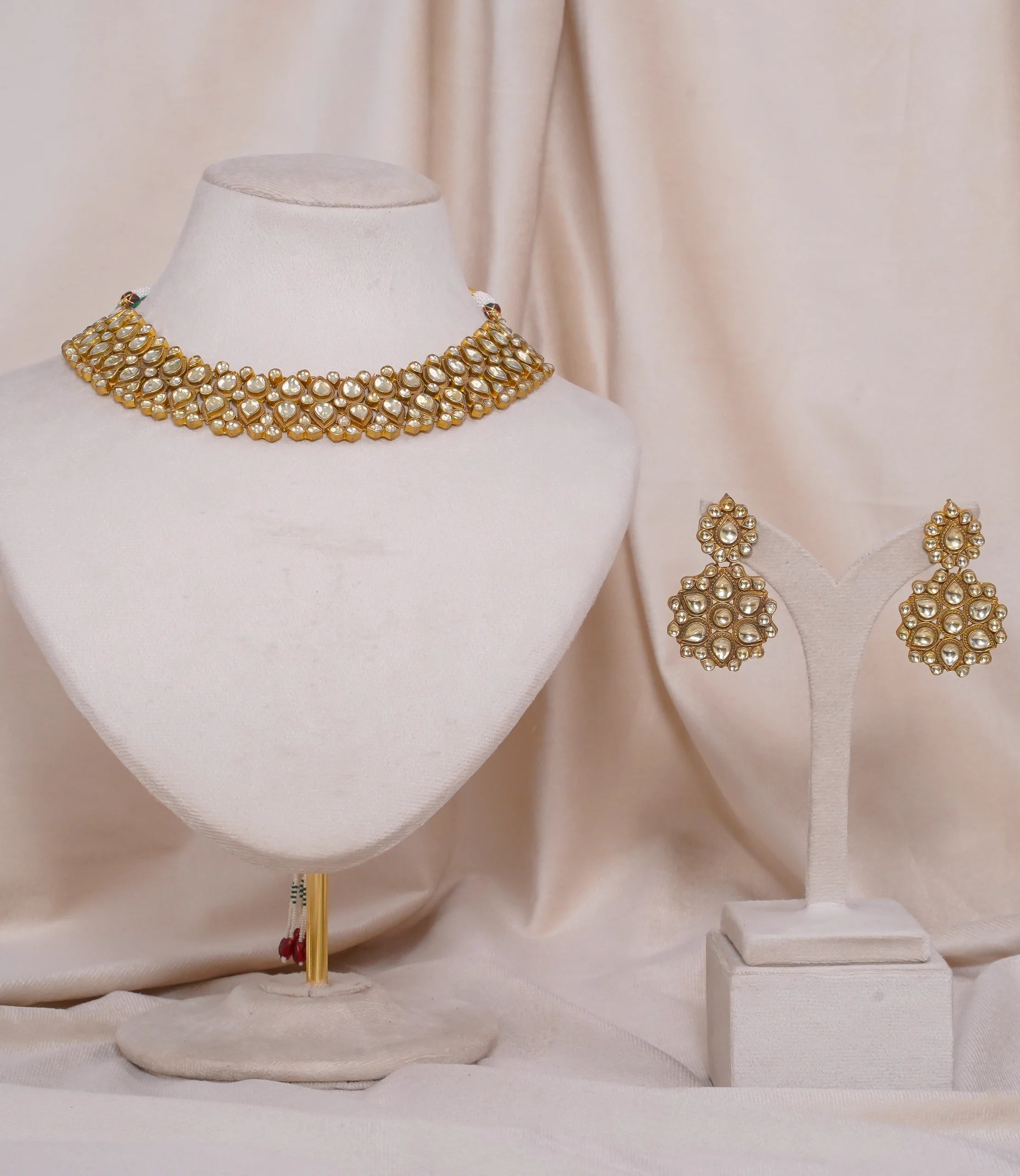 Gold kundan choker necklace with matching earrings, traditional Indian bridal jewelry set