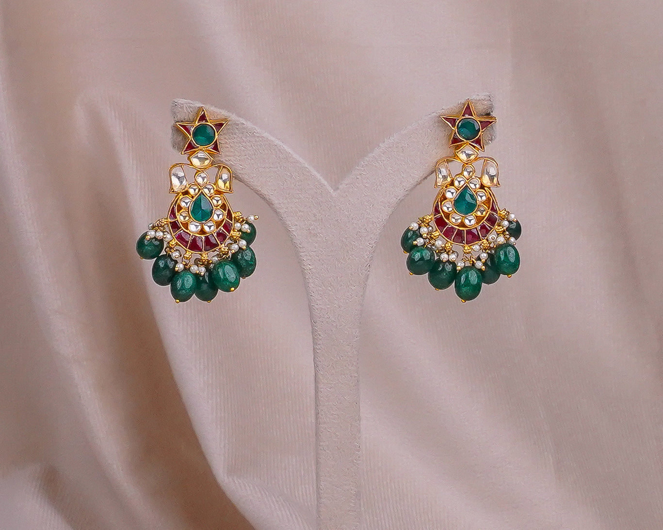 Emerald and ruby gold jhumka earrings with pearl drops, traditional Indian bridal jewelry