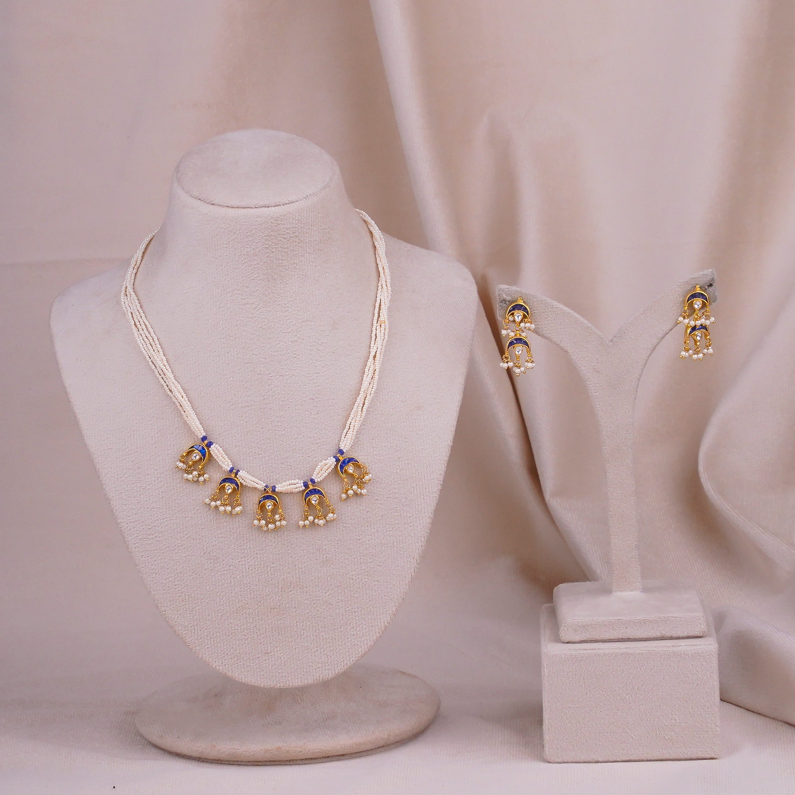 Elegant pearl necklace with blue enamel gold jhumka pendant and matching earrings set